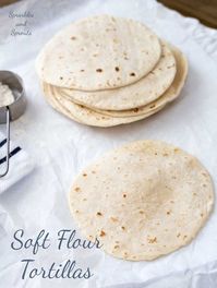 Soft homemade flour tortillas, essential for tacos, quesadillas, burritos and fajitas. Learn how to make soft flexible home made tortillas with just 5 ingredients. SO easy to make at home! Plus you can use white or whole wheat flour. #tacotuesday #flourtortilla