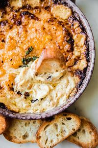 Hot caramelized onion dip made with melted brie and gruyere. This recipe is made with jammy caramelized onions and lots of gruyere!