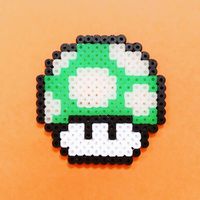 Here's a 1Up for your inner Super Mario with this glow in the dark pixel art sprite of a Green Mushroom, made of fuse beads (Artkal, Hama, Perler). You can use this as a free pattern to create your own pixel art with fusebeads or any other medium you prefer for creating pixel art. Save this pin to your Arts and Crafts board or your DIY decor board and visit my Instagram page for more free patterns. #pixelart #fusebeads #nintendo