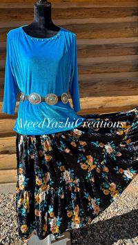 Native American outfit. Velvet top, sizes ranging from xs and up. Velvet tiered skirt made with an elastic waist band for any extra room needed. Sizes ranging from Xs and up.