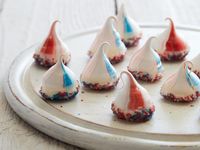 These red, white and blue meringues are easy to make and use a clever decorating trick: Paint lines of food coloring gel up the sides of a pastry bag before filling it with meringue, and each cookie comes out striped as you pipe it. You can use this same trick with frosting for cupcakes.