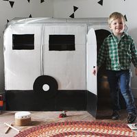 Make a mini camper playhouse for your little ones out of a few cardboard boxes!