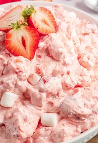 Strawberry Fluff Salad is a creamy, light, and fluffy side dish or serve it as a quick tasty dessert salad. Easy to make with 6 ingredients.