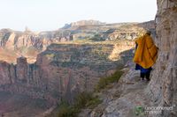 Following the 78-year old monk on a cliff's edge to the 6th century cave church of Daniel Korkor in Tigray, Ethiopia. Yes, it is as steep a cliff as it looks...