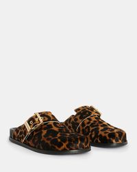 In between seasons? Slip into these. The Venus are going to see you through. Textured leather with a shearling inner - this round toe mule is completed with our statement buckle.  Mule Textured leopard print   Large square roller buckle Slip on Round toe If you are between sizes, we recommend sizing up