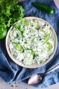 Light and refreshing, this simple Mexican-style cilantro lime cucumber salad is perfect for summer. This healthy side dish is a great accompaniment to grilled salmon, chicken, and more. Naturally gluten-free and vegetarian. #cilantrolimecucumbersalad #cucumbersalad #Mexicancucumbersalad #Mexicansalad #summersalad