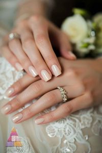 Say "I do" with these sophisticated nude wedding nails, featuring a glossy finish that exudes elegance. These wedding nails for bride are the epitome of classy bridal nails, ensuring your hands look as stunning as your gown. Find your nail inspiration at nailhow.com.