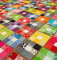 Nine patch, scrappy in same color with center of all using the same color. Many of them make an attractive quilt. Maybe sashing using center color.