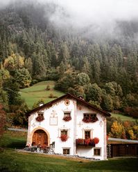 val mustair, switzerland - travel | switzerland - swiss alps - mountains - forest - village - house - architecture - clouds - cloudy - mountain - europe - eurotrip - roam - roaming - trip - holiday - wanderlust - adventure - explore - bucket list - vacation - discover places - get lost - long term travel - idea - ideas - inspiration - landscape photography