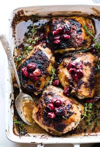 Slow roasted chicken made with a delicious balsamic chicken marinade, cranberries, and fresh thyme. This paleo one pan chicken recipe is so easy to make! #paleo #chickenrecipes #easydinner #healthyrecipes