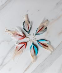 These teardrop leather earrings are adorned with a vibrant peacock feather and totally scream bohemian style! Topgrain Leather