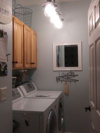 My redecorated tiny laundry room.  Paint helps alot! BM Ocean Air with Decorators White ceiling.  New Light fixture.