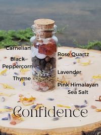 A blend of intentional herbs and crystals creates this confidence spell jar