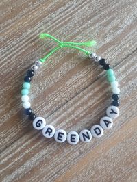 A Green Day bracelet that I made bc I love them💚