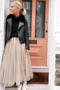 The Polka Dot Maxi Tulle Skirt is a luxurious showstopper. Crafted with creamy layers of tulle dotted with black velvet and detailed with a satin bow tie, it will sit high on your waist, offering a look of elegance and refinement. The tulle is unfinished at the hem and hand finished, making this skirt truly exclusive. Size Small - 6-10 | Medium - 12 | Large - 14 | Extra Large - 16 Measurements Elasticated waist at full stretch (from side to side) on the: Small: 44cm approx. Medium: 48cm approx.