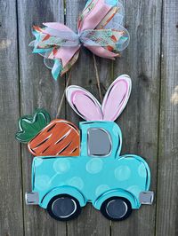 "This 18\" Easter truck is fun and funky to add a little Bunny spirit to your door! This item is hand painted and may vary slightly than pictured.  Ribbon also may vary based on availability.  The truck area can be personalized with your preference by leaving a note on your order placed."