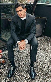 Monochrome business casual inspiration with a charcoal sweater black leather lace ups silver watch white button up shirt black sweater #businesscasual #suit #sweater #menswear #mensfashion #menstyle #monochrome #minimal #mensapparel