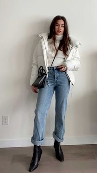 Easy Winter Outfit: wearing a ﻿white turtleneck sweater tucked into & Other Stories straight mid rise organic cotton jeans that I like to roll at the bottom. Then I add my favorite Leather cowboy boots and faux-leather puffer jacket plus Loewe leather top handle box bag. Super easy yet cool! #winteroutfit #outfitideas