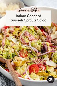 Flavorful Italian chopped salad recipe loaded with shredded brussels sprouts, chickpeas, veggies, salami, olives, peperoncini and cheeses. This delicious and easy chopped salad is tossed in a light Italian dressing and makes the perfect hearty lunch or fresh dinner!