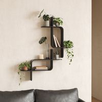 An eye-catching wall shelf that mixes modern shapes and natural bentwood materials, Montage can be used to display books, small plants, decor and more. Its unique shape creates a total of four surfaces for storage with a total weight capacity of 15 lbs. (6.8 kg). Easy to install, this minimalist statement can be mounted vertically or horizontally on your wall. Umbra Color/Finish: Black | Umbra 2 Piece Floating Shelf brownWood in Black | 7.13" H X 12.88" W X 27.63" D | Wayfair | Home Decor