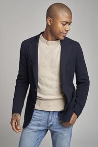 Our new sport coat is designed for today’s more relaxed, casual world. Featuring a Super 130’s wool-stretch blend from Guabello, this jacket features an unstructured cut without any canvassing, padding, or body lining. The relaxed styling makes it similar to a cardigan sweater, and ideal for travelling or easy everyday wear. The unique diagonal texture of the fabric and rich navy colour add a touch of elegance to this modern piece.