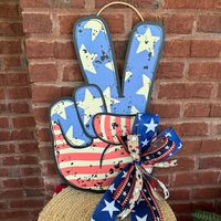 Place this adorable patriotic peace sign wood door hanger on your front porch to greet your guests for summer.  Having a pool party? Add this 22"  wood door hanger as an accent piece for your July 4th decor.  This summer door hanger is perfect for front porches, by the pool, beach houses, lake houses, or anywhere you need some summer in your life! Super fun for the summer! Check out the other items available! https://www.etsy.com/shop/SugarBritchesCrafts Follow me on Facebook! https://www.facebo