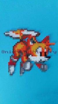 Pixel art sprite of Tails the Fox from Sega's flagship retro video game series Sonic the Hedgehog. You can use this free pixel art pattern to create your own pixelart with fuse beads (Artkal, Hama, Perler) or with any other medium you'd like to create pixel art with: mosaic tiles, cross stitching, diamond painting, anything is possible. There are more free patterns on my video game inspired Instagram page and on this Pinterest board.