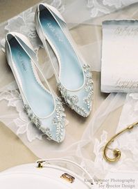 Willow sparkly flat shoes for wedding occasions are from the 'Enchanted' bridal collection. These almond toe crystal flat shoes feature romantic hand-beaded milky teardrop rhinestones and beads that shine bright like a diamond. The soft, luxurious ivory silk piped material adds to the shimmer of these glitter flats wedding slippers, while extra padding adds all-day comfort. To top it off, Willow silver flats wedding shoes have a 'something blue' sole to check off your tradition list. FEATURES: H