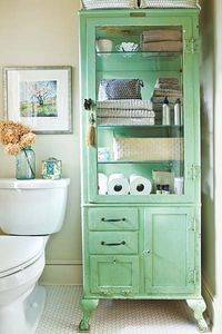 bathroom with a salvaged apothecary cabinet painted hemlock green used as storage, hemlock green from pantone color of month may 2014