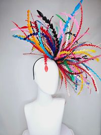 From the 2024 Featured Milliner of the Kentucky Derby Museum  Gorgeous Kentucky Derby hat fascinator  kentucky derby hat fascinator rainbow huge blue red yellow green pink orange black zigzag feather headpiece  huge impact but light as a feather! super comfy! headband attachment.  each hat is totally one of a kind! no two are alike! I can probably add feathers, flowers etc to existing hats for a small fee. I cannot remove anything from existing hats. Just message me and see if we can make it wor