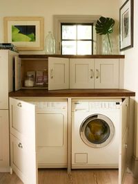 Hidden laundry room within cabinet