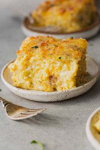 This cheesy breakfast souffle is light and fluffy and so cheesy. It's going to be your new favorite breakfast! #recipe #breakfast #cheese #sausage #souffle