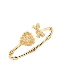 Signature yellow gold bracelet featuring the magnificent sacred heart, symbol of unconditional love and faith, and an elegant bow, both enriched with diamonds. The bracelet is adorned with beautiful baroque decoration, inspired by bourbon era. The DG logo is engraved inside the heart., Diamond, 0.25 tcw 18K yellow gold Made in Italy SIZE Diameter, 2.3 ABOUT THE BRAND