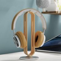 This unique Nordic wood headphone stand is crafted with beautiful bamboo or walnut wood. This minimalist wooden headset holder is perfect for gaming headsets, noise cancelling headphones, etc. The base is made with sturdy aluminum alloy and also comes with a soft silicone anti slip pad so as to not scratch your desk.