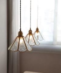 Illuminate your space in style with the classic brass glass pendant light. This timeless piece features an elegant glass pendant light, hanging from the fabric twisted cord for an elegant finish. Perfect for adding a touch of sophistication to any room, this chic pendant light will add a warm and inviting ambiance to a