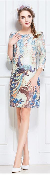 Embody the beauty and elegance of a peacock! This dress in gorgeously decorated with beautiful peacocks surrounded by a stunning garden of hanging blossoms and blooming flowers, the colors are delicate and the modest cut is perfect for any event