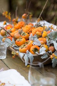 centre de table automne fruit kaki feuilles cineraire maritime