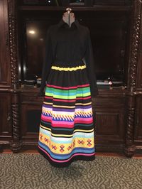 New Seminole Patchwork Skirt measures 38" length and the waist is elastic and can be adjusted to fit whatever size you need. I am a member of the Seminole Nation of Oklahoma. Mvto!