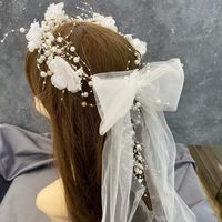 With Bow Pearl flower crown is made of Pearl and chiffon flowers. The two ends meet at the back with an organza ribbon, so it's one size. Crown is a simple and beautiful piece suitable for brides, flower girls, bridesmaids. It is easy to use.