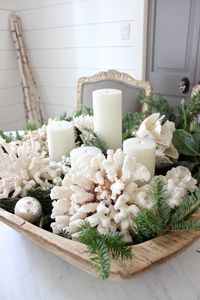 Picked up some pretty white candles and a few silver balls from HomeGoods to help this vintage dough bowl get ready for Christmas. Added greenery and coral for the finishing touch! #happybydesign #sponsored