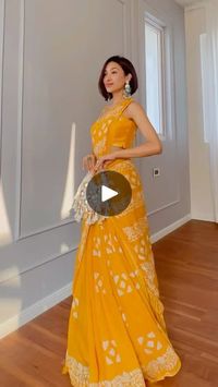 2.5M views · 177K reactions | An easy saree drape to try for your haldi function 🎨

Saree & jewellery: Locally sourced :)
Bag: Amazon 

#weddingguestoutfit #haldilook #yellowsaree #stylingtips | Isha Borah