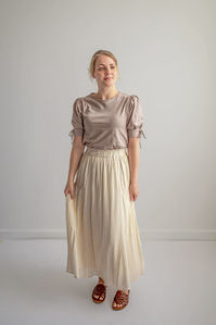 Add a touch of charm with the 'Irena' textured skirt in cream. Featuring a gentle crinkle ribbed fabric and piping detail, this summery skirt is lightweight, but fully lined. This skirt easily pairs with so many pieces you already own!