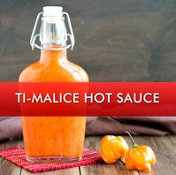 Learn how to make Ti-Malice, a popular Caribbean hot sauce originating from Haiti, made with Scotch Bonnet chili peppers. It has an interesting origin story in Haitian folklore and has many variations. This is our favorite way to make it. #condiment #hotsauce #spicy