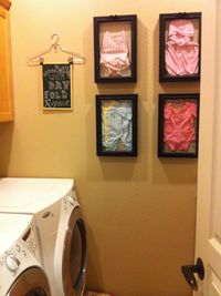 Laundry Room Decor Using Favorite Baby Clothes in Shadow Boxes