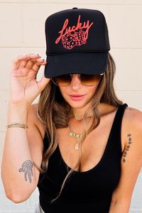 Inspired by VEGAS baby, our Lucky Roll trucker hat features hand drawn lettering and dice illustration. We love Vegas for food, occasional luck at the tables, pool days and visits to grandma! This black trucker hat features an adjustable snapback, mesh backing and foam front! Size: One size fits most Material: 100% Polyester Made in Myanmar + USA Designed in Ventura, CA