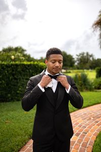 The groom suited up for his wedding day at Casa Feliz Historic Venue #Groom #OrlandoWeddingPhotography #FloridaWeddingPhotographer #OrlandoWeddingVenue #OrlandoWeddingDecor