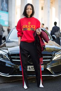 Yoyo Cao poses wearing a Gucci sweater after the Sacai show at the Palais de Tokyo during Paris Fashion Week Womenswear SS17 on October 3 2016 in...