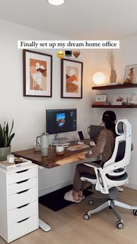 ’m obsessed! Details on everything ⤵️  ⠀  ✨Desk: @upliftdesk Saman Live Edge 60” x 30” solid wood standing desk with white V2 C-Frame  ⠀  ✨Chair: @upliftdesk Pursuit Ergonomic Chair  ⠀  ✨White drawers: @ikeausa Alex Drawers  ⠀  ✨Keyboard: custom mechanical keyboard built by my hubby. He used “Cherry Sand” key caps from @novel.keys  ⠀  ✨Mouse: @logitech Lift Vertical Ergonomic Mouse  ⠀  ✨Drinkware: mug by @tworidgespottery, water cup/bottle by @stanley_brand  ⠀  ✨Speakers, laptop stand & monitor stand are in my Amazon Storefront (🔗 in bi0)  ⠀  ✨Roaming America is my book about traveling to all the US national parks - @roamingamericabook  ⠀  ✨Art above desk: custom prints from @codeywhite.art + @framebridge walnut frames  ✨Shelves: @ultra_shelf on Etsy, in Walnut  ⠀  ✨Light on shelves: @