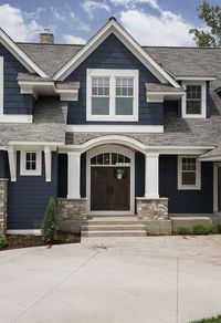 The exterior color is Benjamin Moore Hale Navy. The stone is from Hedberg in Golden Valley, MN. It is a Cedarcrest blend which is a mix of 33% Flathead Ledge, 33% Blue River Variegated, 33% Rustic Cedar. Mortar Color: Natural. Joint: Tight. Sill Type: Indiana 2.25” Thickness.