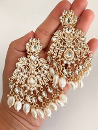 Bollywood Look Handcrafted 22 Kt gold plated kundan chandbali with Kundan Polki/stones embedded with gold foil. Height = 95 mm (3.74 inches) || Width = 62 mm Bollywood Look Indo Western Earring Highest quality and craftsmanship. We stand behind our products - 100% satisfaction guaranteed. Ready to ship from Edison NJ USA